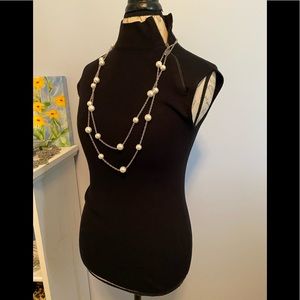 Carmen Marc Valvo black mock neck sleeveless top